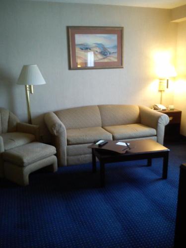 a living room with a couch and a coffee table at Wyndham Garden Monterrey Norte in Monterrey
