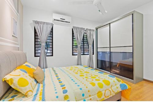 a bedroom with a bed and a large window at Suraya Homestay Semi-D in Sepang