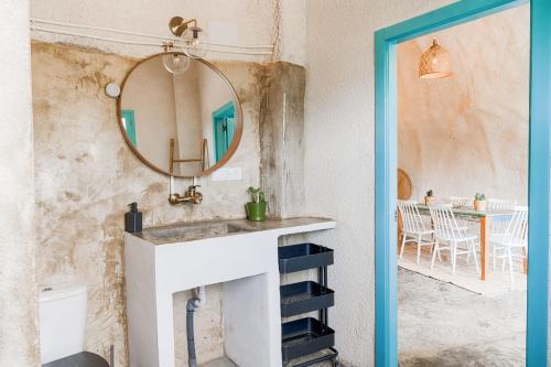a bathroom with a sink and a mirror at Finca Les Coves in Jijona