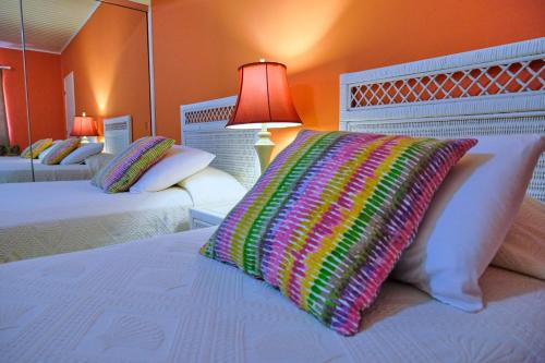 Lova arba lovos apgyvendinimo įstaigoje Aruba Quality Apartments & Suites