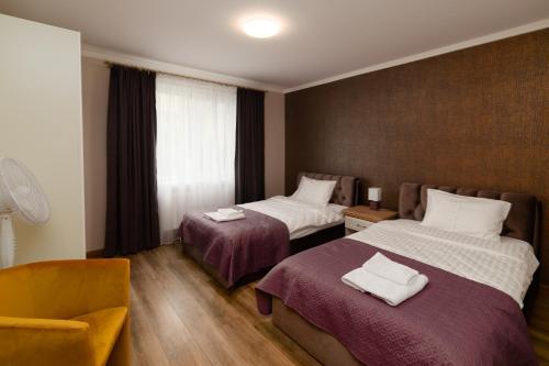 Ένα ή περισσότερα κρεβάτια σε δωμάτιο στο TAKO Apartments parking free