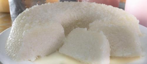 a pile of rice on a white plate at Pousada Elo Inn in Recife