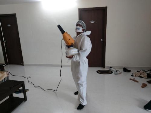 a person dressed in a gasmask holding aqualuitous at Feel like home -Guest House near Tenneti park in Visakhapatnam