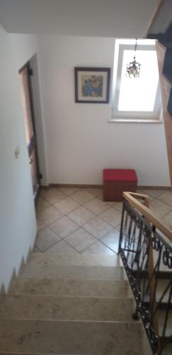a room with a staircase and a window on the wall at Love 2 Solkan in Nova Gorica