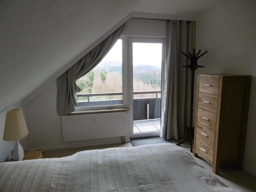 Кровать или кровати в номере Ferienwohnung Panoramablick