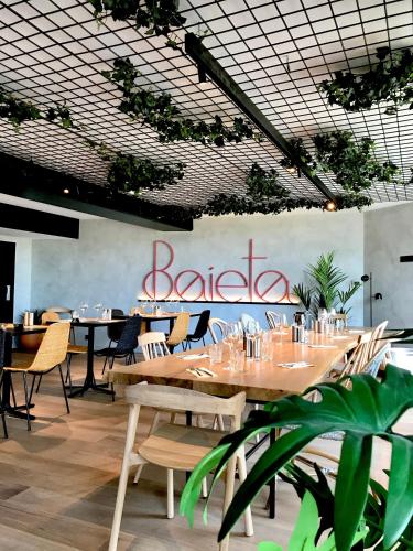 a restaurant with tables and chairs and a sign that reads ballet at ibis Nice Aéroport Promenade des Anglais in Nice