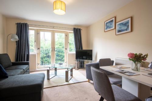 a living room with a couch and a table at No6 Nursery Convent in Mansfield