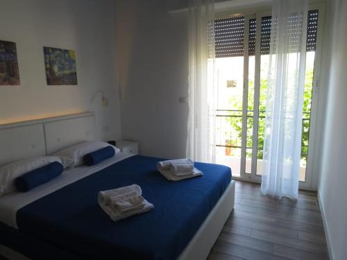 Postel nebo postele na pokoji v ubytování B&b Angolo 29