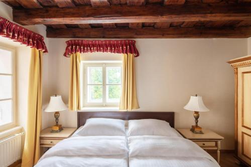 a bedroom with two beds and a window at Hotel Residence Green Lobster in Prague
