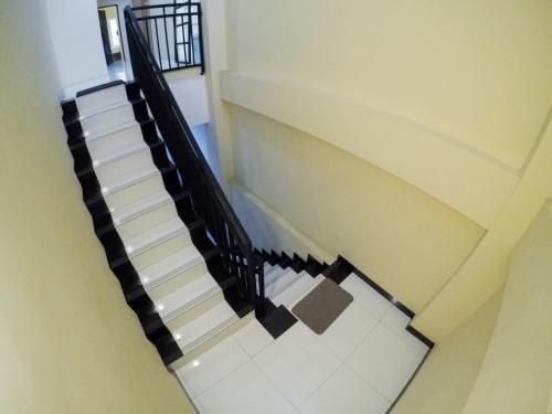 a view of a staircase in a building at City Residence Kutai 32 in Surabaya