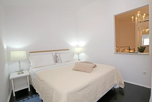 מיטה או מיטות בחדר ב-Swan City Apartment & Room