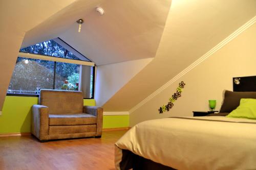 Ένα ή περισσότερα κρεβάτια σε δωμάτιο στο Hostal Kolibri B&B