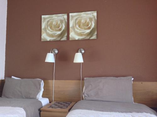 A bed or beds in a room at The Premier Lodge 