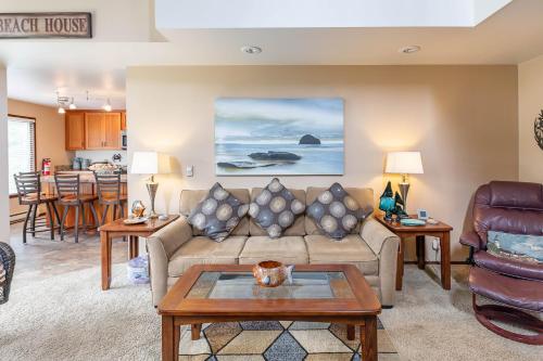 a living room with a couch and a table at Gaea House in Seaside
