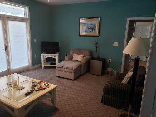 a living room with a couch and a table at Blue Heron Inn - A Bed and Breakfast LLC in Solomons