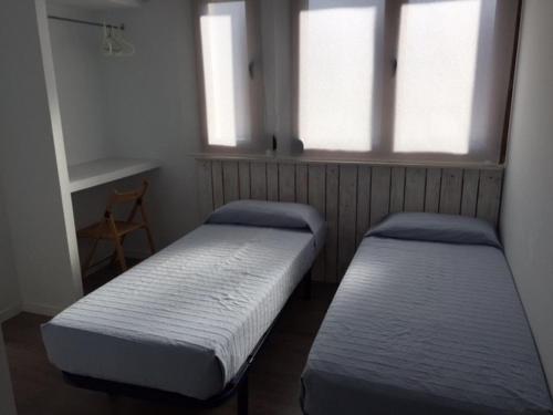 Postel nebo postele na pokoji v ubytování Camping Ezcaba
