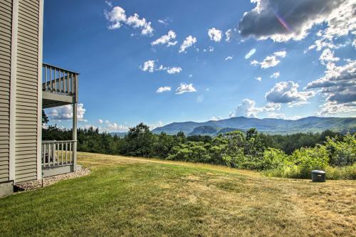 a view of the mountains from the back yard of a house at Intervale Family Retreat Mtn View and Pool Access! in Intervale