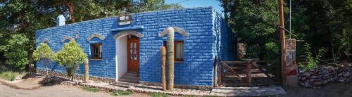 a small blue house in a yard at Azul Humahuaca Hostal in Humahuaca
