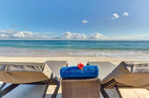 a view of the beach with chairs and the ocean at Royalton Bavaro, An Autograph Collection All-Inclusive Resort & Casino in Punta Cana