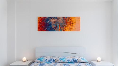 En eller flere senge i et værelse på Appartamento Fronte Mare Trilocale