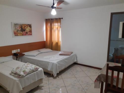 Katil atau katil-katil dalam bilik di Psiu Lanches e Hotel Veraneio