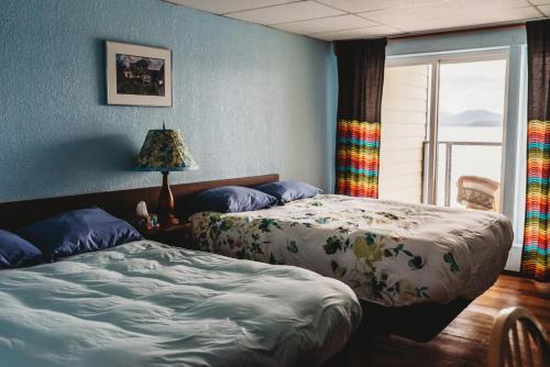 Un ou plusieurs lits dans un hébergement de l'établissement The Oceanfront Hotel