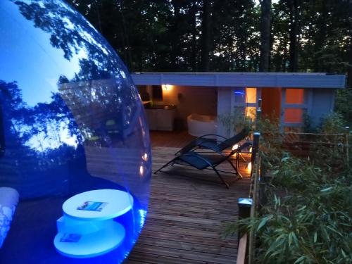 a backyard with a toilet in a glass dome at Bulle d'R in Dournazac