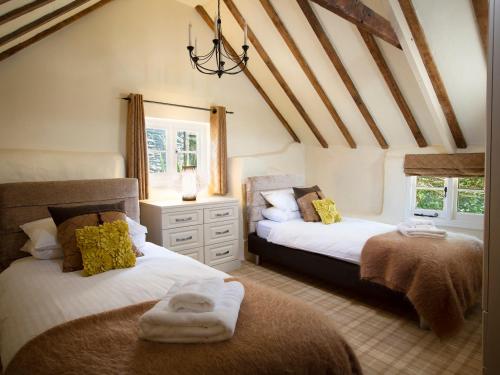 Postel nebo postele na pokoji v ubytování Higher Collaton Cottage