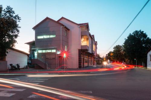 a building on the side of a street at night at Apartments IVI Gevgelija in Gevgelija