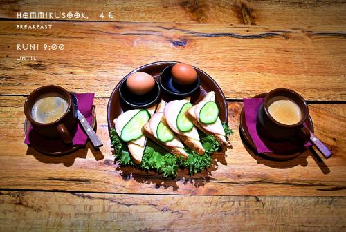 a plate of food with eggs and vegetables on a table at Viikingite küla in Saula