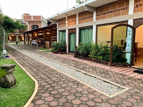 a cobblestone street in front of a building at La Buena Suerte in Tepoztlán