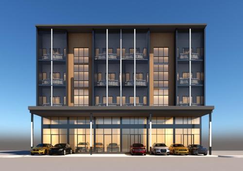 un rendimiento de un edificio con coches aparcados delante en D5 Gold สาขา หนองกะขะ, en Chonburi