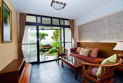 Un lugar para sentarse en Margaret Garden Villa