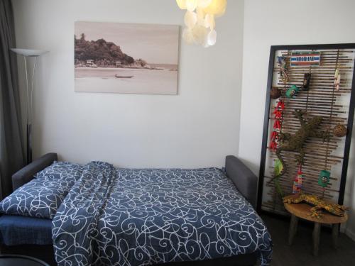 A bed or beds in a room at Bos en Lommer Hotel - Erasmus Park area