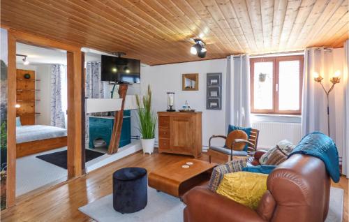 a living room with a couch and a table at Nice Home In Gottmadingen With Wifi in Gottmadingen