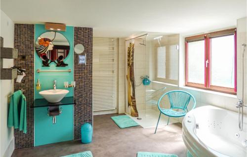 a bathroom with a white tub and a sink and a tub at Nice Home In Gottmadingen With Wifi in Gottmadingen