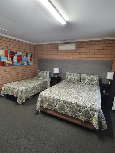 Ένα ή περισσότερα κρεβάτια σε δωμάτιο στο Streaky Bay Motel and Villas