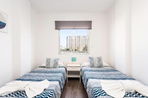 Postel nebo postele na pokoji v ubytování Home2Book Beautiful Apart Los Cristianos Pool Wifi