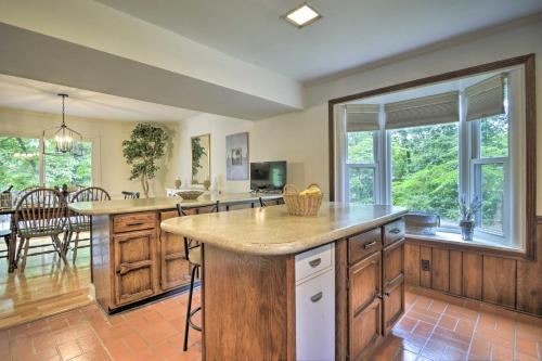 a large kitchen with a large island in a home at Lake and Golf Retreat with Dock and 2 Luxury Decks! in Sanford