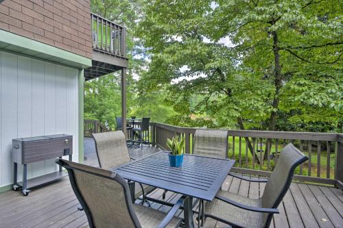 a blue table and chairs on a deck at Lake and Golf Retreat with Dock and 2 Luxury Decks! in Sanford