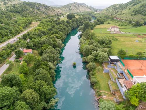 an aerial view of a river with trees at Hotel RIO VERDE in Podgorica