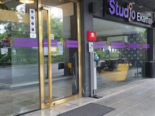 a store front of a store with a sign on it at Studio Ekamai in Bangkok