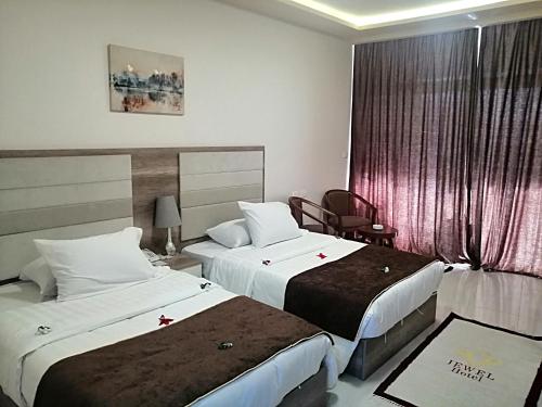 Postel nebo postele na pokoji v ubytování Jewel Inn Beni Suef