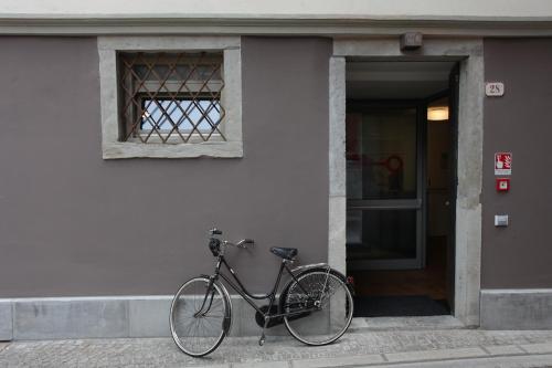 a bike parked on the side of a building at Albergo al Vecchio Tram in Udine