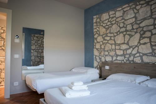 A bed or beds in a room at B&B Casa Campagnari