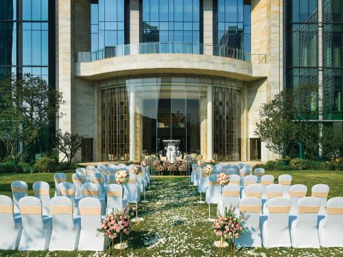 a row of chairs in front of a building at The Langham, Hefei in Hefei