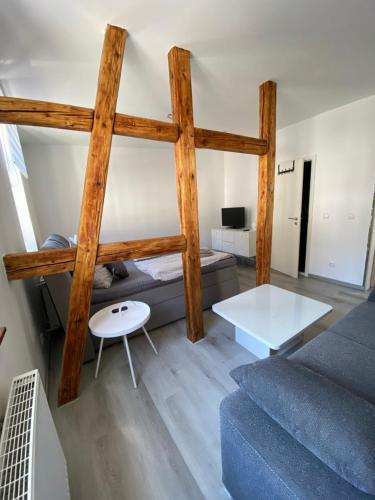 a living room with a loft bed and a couch at Gästehaus Glücksmoment in Erfurt