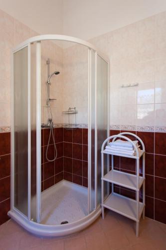 a shower with a glass enclosure in a bathroom at Casa Luisa in Poreč
