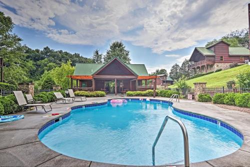 a swimming pool in a backyard with a house at 3 Mi to Dollywood Hot Tub Hideaway in Smoky Mtns in Pigeon Forge