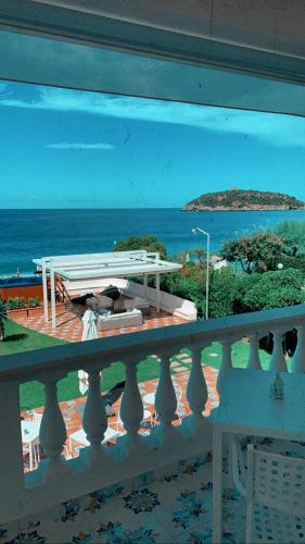 a view of the ocean from a balcony at Villa Pietra Rossa in Diamante
